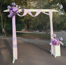 Load image into Gallery viewer, White wood arbour &amp; 2 x purple / violet flowers - HIRE ONLY

