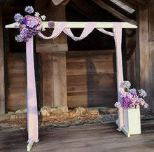 Load image into Gallery viewer, White wood arbour &amp; 2 x purple / violet flowers - HIRE ONLY
