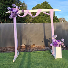 Load image into Gallery viewer, White wood arbour &amp; 2 x purple / violet flowers - HIRE ONLY
