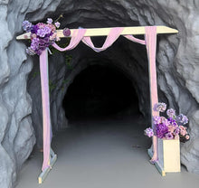 Load image into Gallery viewer, White wood arbour &amp; 2 x purple / violet flowers - HIRE ONLY
