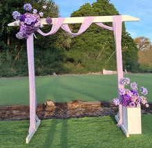 Load image into Gallery viewer, White wood arbour &amp; 2 x purple / violet flowers - HIRE ONLY
