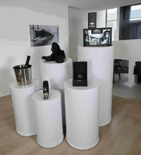 Load image into Gallery viewer, Grooms Preparation Room - Set of 5 White leather look Cylinder Plinths - HIRE ONLY
