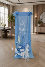 Load image into Gallery viewer, Oh Baby Blue &amp; White Fabric Welcome Sign &amp; Flower Arrangement - HIRE ONLY
