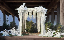 Load image into Gallery viewer, White wooden arbour &amp; flowers w macrame - Deluxe - HIRE ONLY
