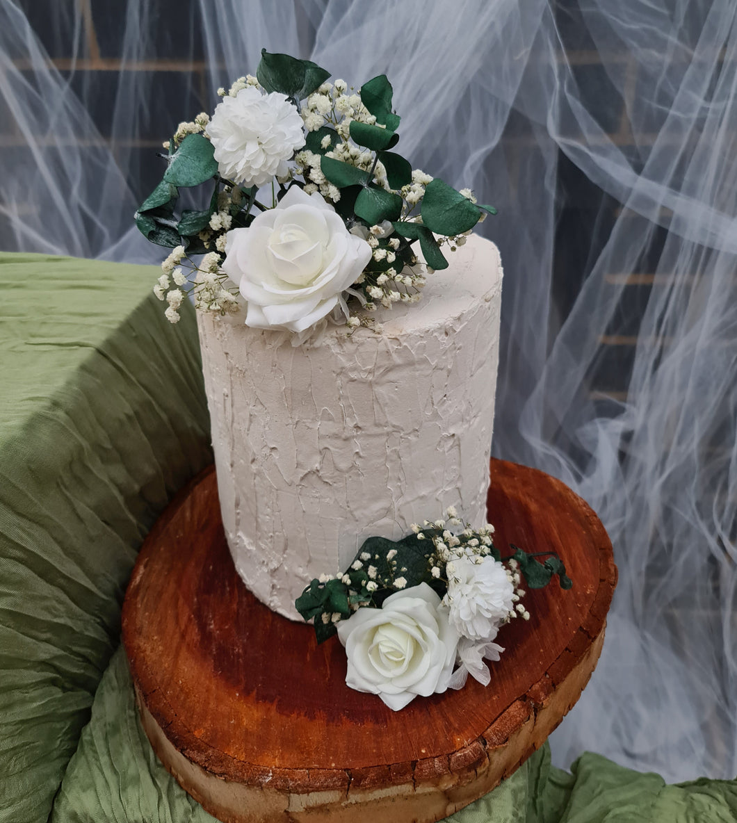 Spinning eucalyptus, white roses & baby's breath cake topper