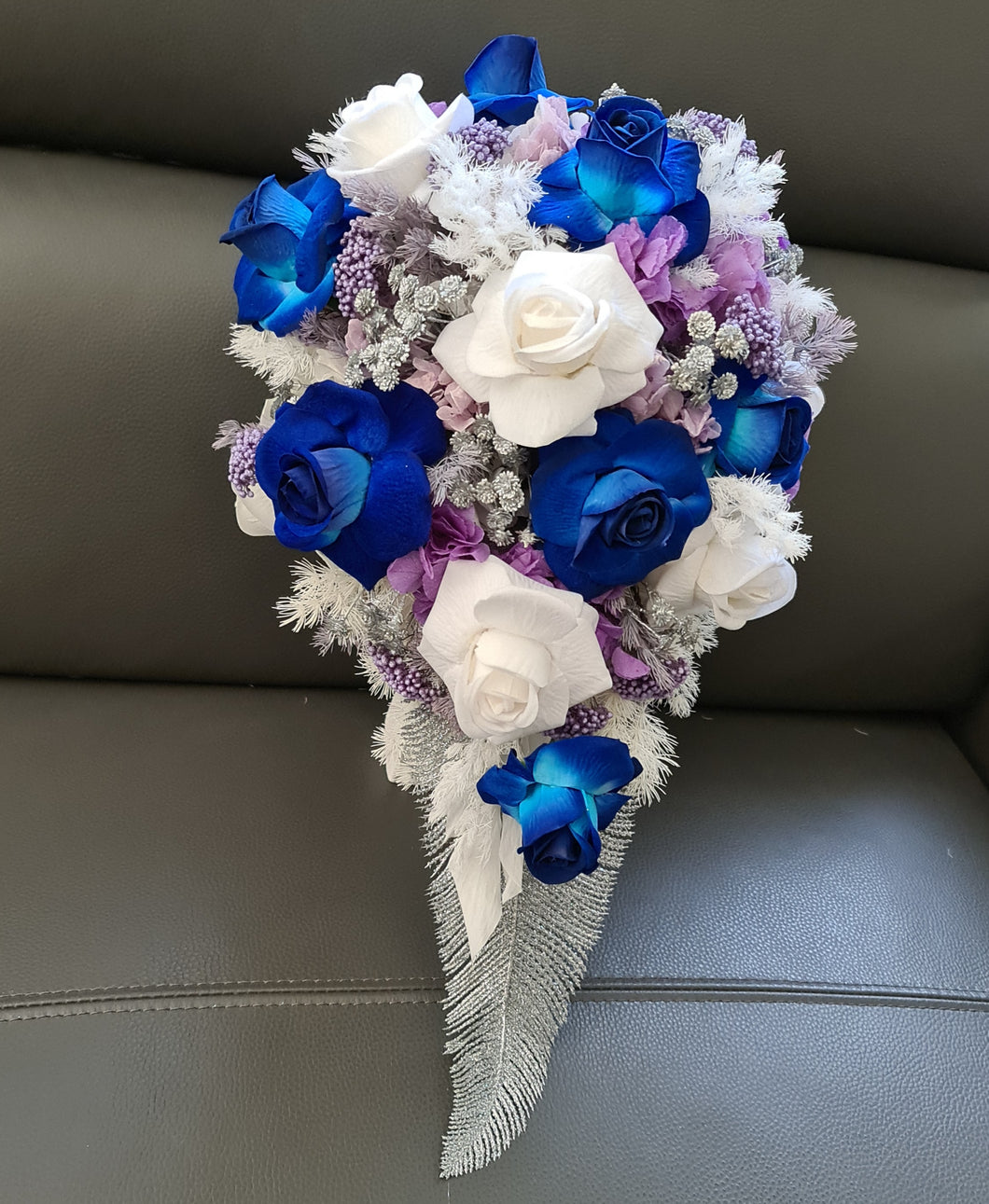 Teardrop bridal bouquet in purple, violet, blue, white & silver