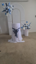 Load and play video in Gallery viewer, Double arch / backdrop 2 x white blue flowers &amp; plinths Package - HIRE ONLY
