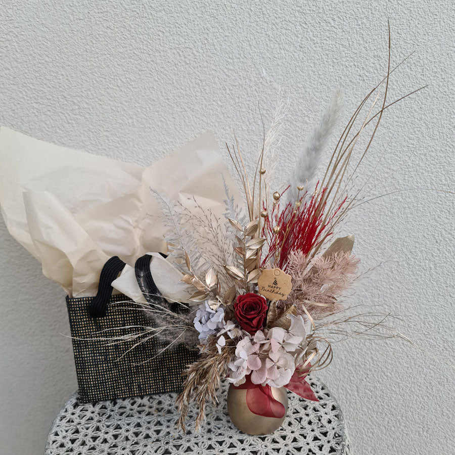 Mini preserved rose in golden pot