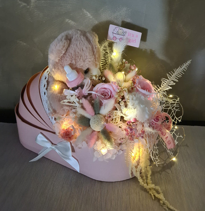 X - Baby girl preserved flowers & toy in pram